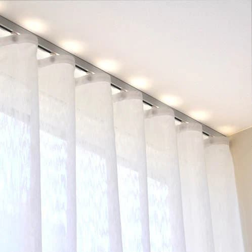 Ceiling-mounted curtain track with white panels
